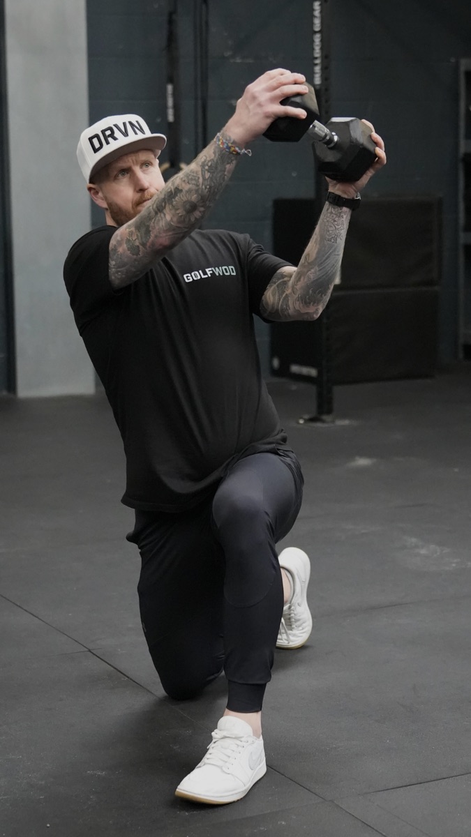 Michael performing a dumbbell exercise